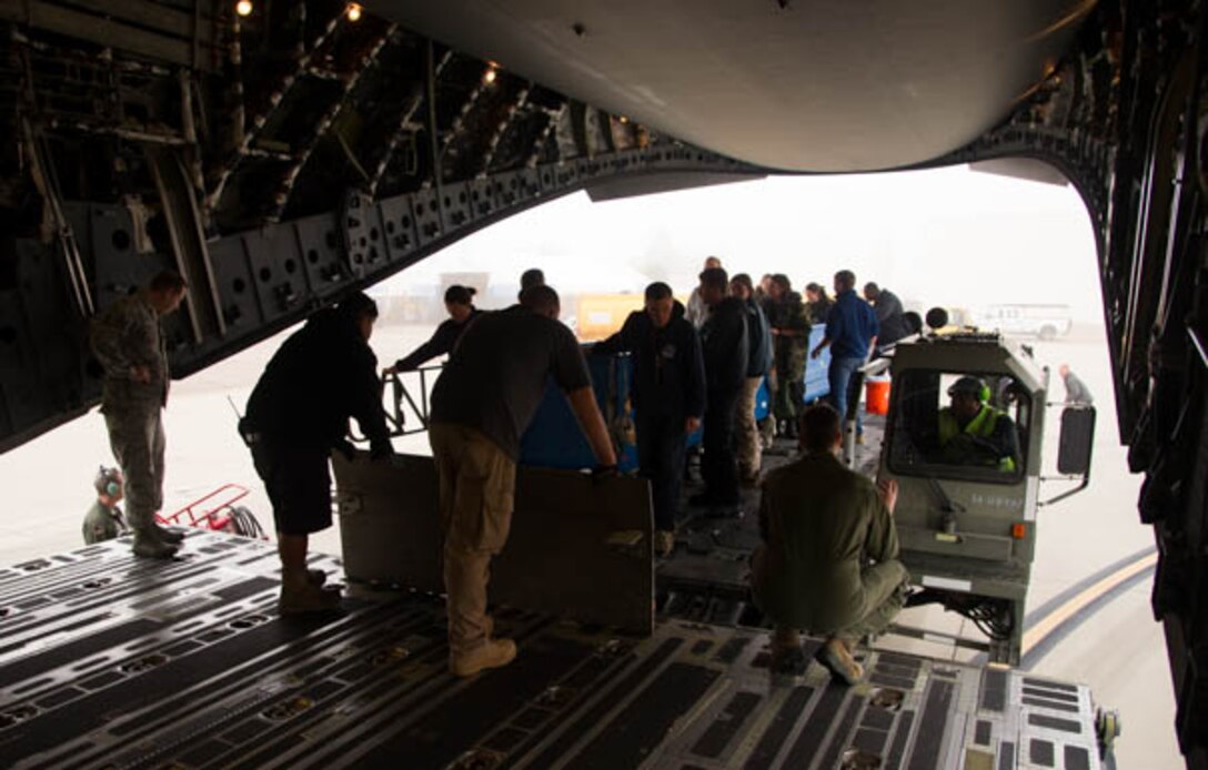 Four dolphins from the U.S. Navy’s Marine Mammal Program are loaded aboard a C-17 Globemaster III operated by the 446th Airlift Wing March 13, 2017. The dolphins were being transported from San Diego to Key West, Florida. (U.S. Air Force photo by David L. Yost)