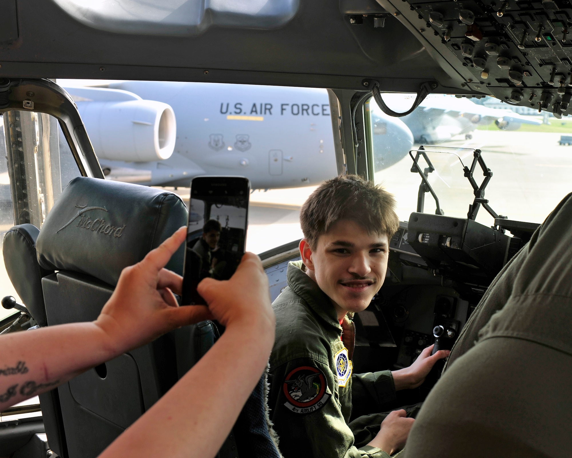 Stillen Rivera, Team McChord’s newest “Pilot for a Day” participant, smiles on the flight deck of a C-17 during his daylong visit to McChord Field, March 23, 2017 on the McChord flightline. The “Pilot for a Day” program has been hosted by Team McChord for the past several years and seeks to fulfil the dreams of youth with limiting disabilities. (U.S. Air Force photo/Staff Sgt. Whitney Amstutz)  