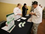 Master Sgt. Darrell DeGroff  speaks to a chef from Red Wind Casino in Lacey,
which was talking to soldiers about job opportunities.
