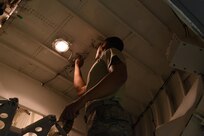 Airman 1st Class Derek Powell, 305th Maintenance Squadron crew chief, performs maintenance in the nose of a C-17 Globemaster III at Joint Base McGuire-Dix-Lakehurst, New Jersey, March 23, 2016. The aircraft is in the shop for the mission essential routine maintenance the 305th MXS provides. 