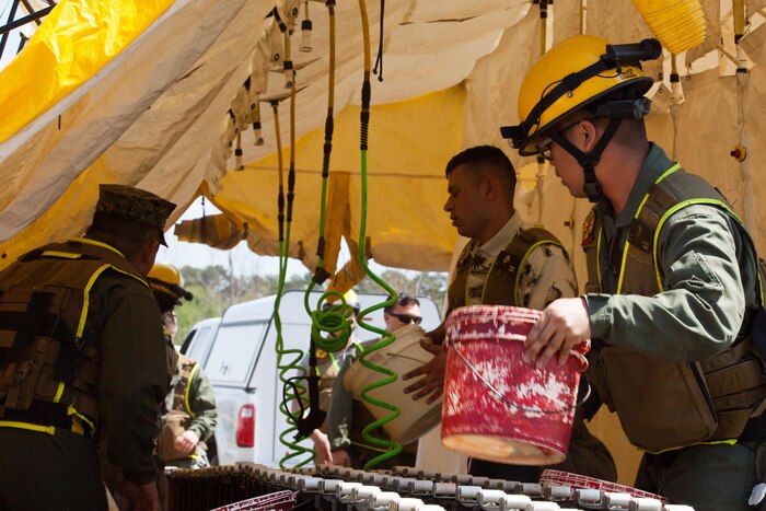 Marines with Chemical Biological Incident Response Force prepare a decontamination tent in Perry, Ga., March 20, 2017, during Exercise Scarlet Response 2017. The exercise is the largest annual event for CBIRF, and it tests the unit’s capabilities to react and respond to threats and disasters such as nuclear detonations.