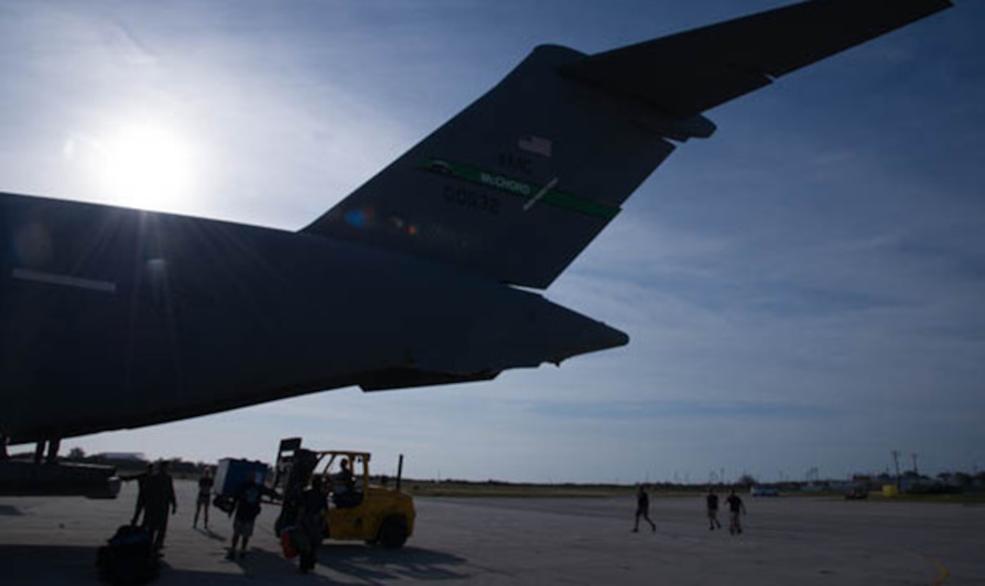 Dolphins from the U.S. Navy’s Marine Mammal Program are unloaded from a C-17 Globemaster III, operated by the 446th Airlift Wing, March 13, 2017. The dolphins, with trainers and veterinarians, were being transported from San Diego to Key West, Florida. (U.S. Air Force photo by David L. Yost)