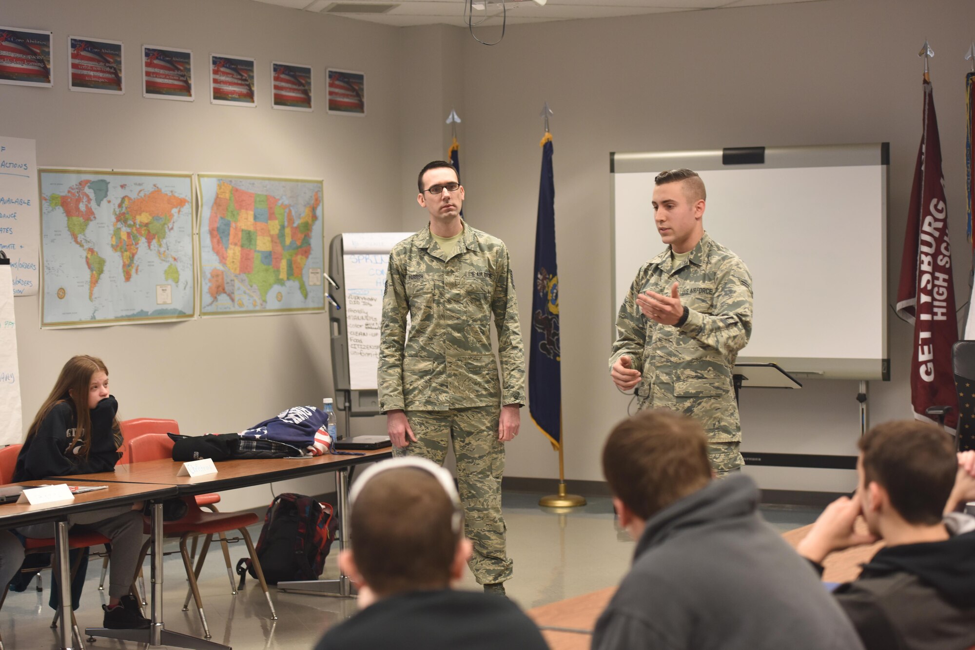 Airman 1st Class Chase Deckert, right, speaks to a Junior Reserve Officer Training Corps class at Gettysburg High School, Gettysburg, Pennsylvania, March 23, 2017, about his career at the 193rd Special Operations Wing working in the aircraft metal technology field. Deckert, who graduated from Gettysburg HS last year, joined Tech Sgt. Jordan Parrish, 193rd SOW production recruiter and retainer, in educating the JROTC class about the career opportunities and benefits that the 193rd SOW has to offer. (U.S. Air National Guard Photo by Master Sgt. Culeen Shaffer/Released)