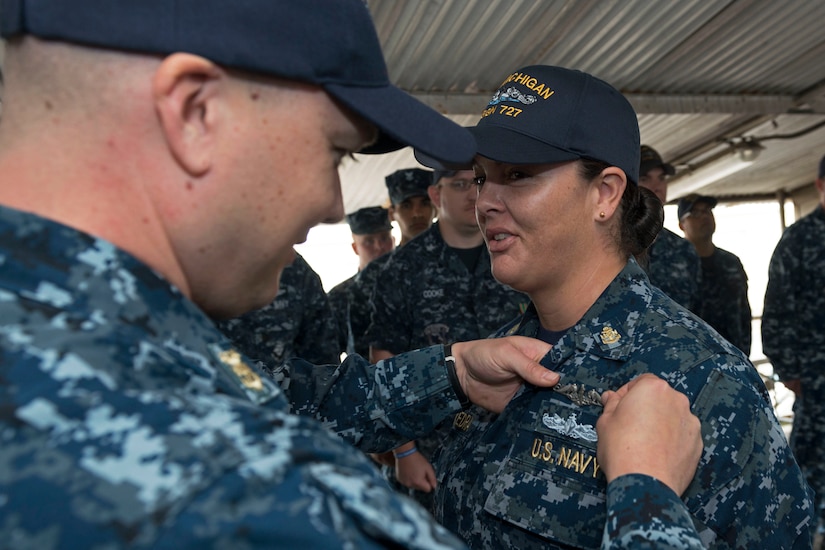 The Defense Advisory Committee on Women in the Services, also known as DACOWITS, on March 24, 2017, released its annual report on matters relating to women serving in the U.S. armed forces for fiscal year 2016. DACOWITS provides the Defense Department with advice and recommendations on matters and policies relating to the recruitment and retention, treatment, employment, integration and well-being of highly-qualified professional women in the armed forces. Pictured here, Navy Chief Petty Officer Dominique Saavedra, assigned to USS Michigan, is pinned with her enlisted submarine qualification during a ceremony at Puget Sound Naval Shipyard, Wash., Aug. 2, 2016. Saavedra was the first female enlisted sailor to earn the "dolphins." Navy photo by Chief Petty Officer Kenneth G. Takada