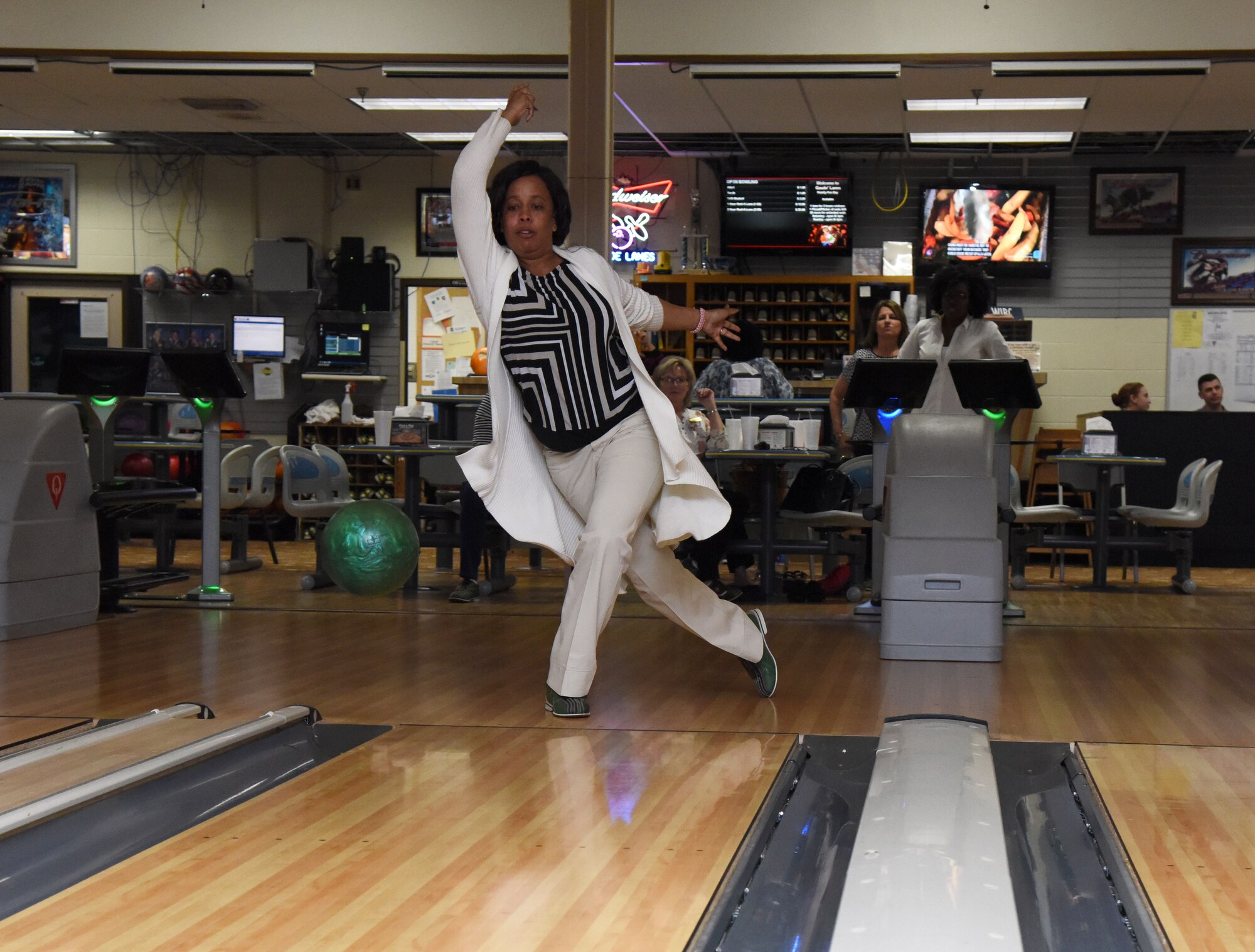 Angie Woods, 81st Training Wing sexual assault response program specialist, bowls during a Care for the Caregiver event at Gaudé Lanes March 23, 2017, on Keesler Air Force Base, Miss. The event, hosted by the 81st Training Wing Chapel staff, was open to units who provide mental, spiritual and social care for Airmen and their families and included fellowship, bowling and food. (U.S. Air Force photo by Kemberly Groue)