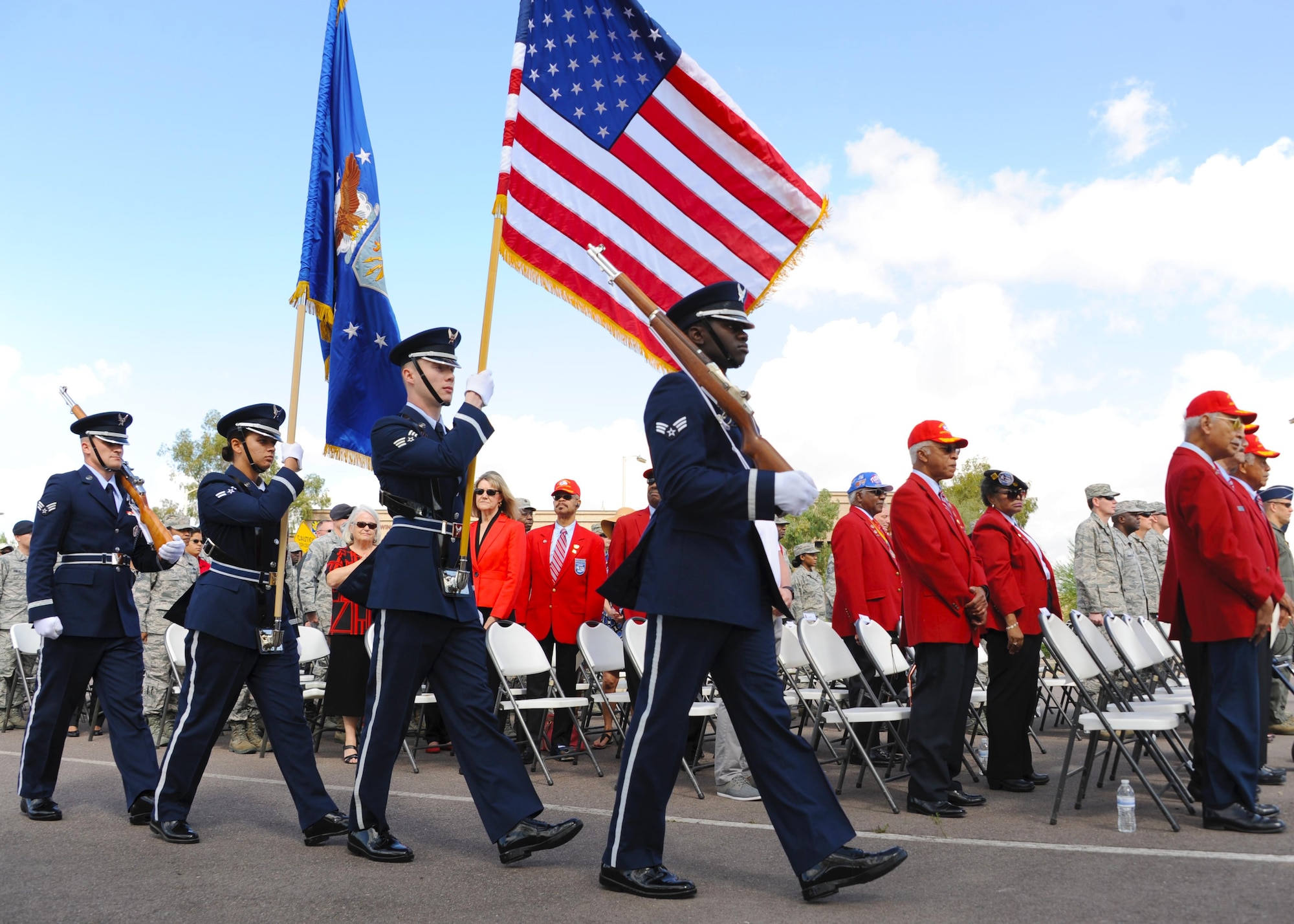 Luke Honor Guard members march into the Fourth Annual Commemoration Day for the Tuskegee Airmen March 23, 2017, at Luke Air Force Base, Ariz. A presentation of colors, playing of taps and the laying of a wreath was all part of the ceremony commemorating the Tuskegee Airmen. (U.S. Air Force photo by Airman 1st Class Caleb Worpel)