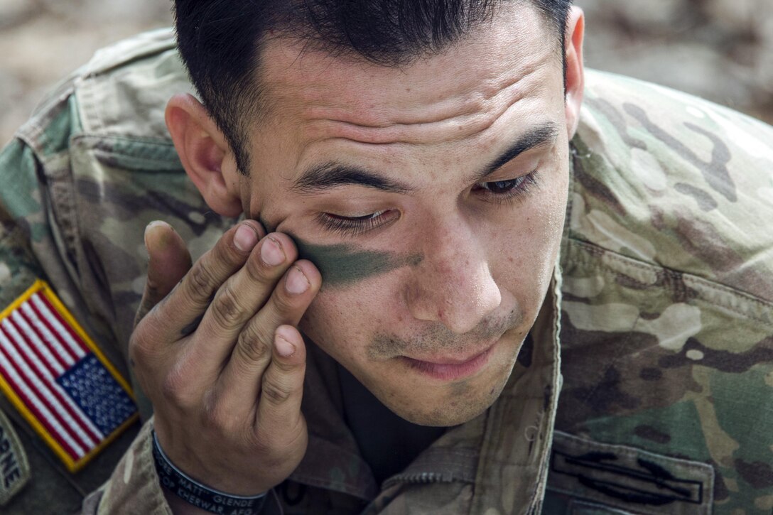 Army Staff Sgt. Armando Alvarado applies face paint during training for an Expert Infantryman Badge competition at Fort Jackson, S.C., March 17, 2017. Alvarado is assigned to the 2nd Battalion, 13th Infantry Regiment. Army photo by Robert Timmons

