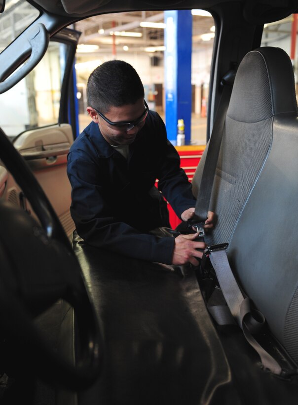 U.S. Air Force Airman Dan Ezekial Hesultura, 7th Logistics Readiness Squadron vehicle mechanic, performs a quality check after tightening a seat belt at Dyess Air Force Base, Texas, Jan. 5, 2017. Vehicle maintenance Airmen will complete anywhere from 30 to 70 work orders each week. (U.S. Air Force photo by Airman 1st Class April Lancto)