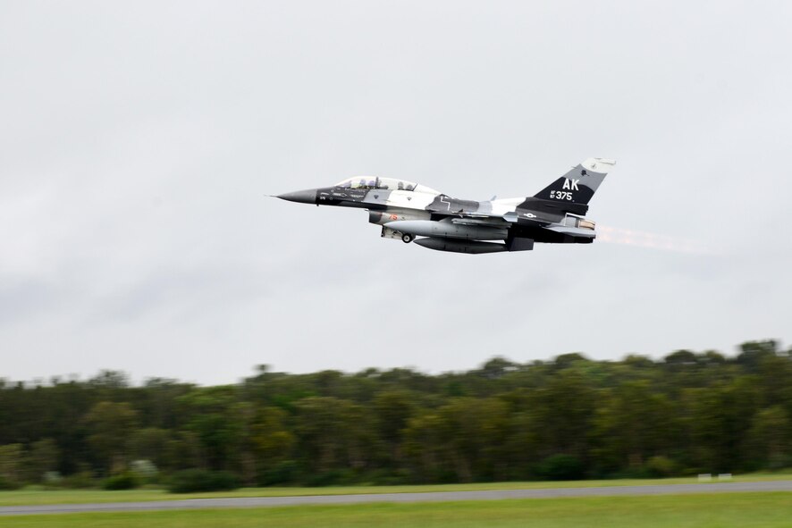 U.S. Air Force Maj. Shawn McGoffin, 354 Fighter Wing deputy inspector general and F-16 pilot, and U.S. Air Force Tech. Sgt. Wesley Walker, a 354th Maintenance Squadron aircraft munitions systems specialist, take off in an F-16 Fighting Falcon at Royal Australian Air Force Base Williamtown, in New South Wales, Australia, March 24, 2017. Prior to the 18th Aggressor Squadron completing their final sortie in Exercise Diamond Shield, Walker was offered an opportunity to observe the mission of training and preparing Royal Australian Air Force fighter combat instructors, airspace battle managers, fighter intelligence instructors and fighter combat controllers of the RAAF Air Warfare Centre Instructors Course from a perspective he’s never seen before; from 30,000 feet in the air. (U.S. Air Force photo by Tech. Sgt. Steven R. Doty)