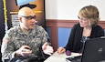 Lt. Col. Christopher Eng, a U.S. Army Reserve officer currently assigned to the Defense Threat Reduction Agency, discusses his future plans with MyArmyBenefits contractor representative, Linda Wellman. Wellman, a retired Army Reserve chief warrant officer four, also contributes her personal experience and knowledge when discussing retirement plans. MyArmyBenefits was one of the organizations represented at the 99th Regional Support Command’s Army Reserve Pre-Retirement Training at Fort Belvoir, Virginia, March 18, 2017. (Army Reserve Photo by Capt. Valerie Palacios/ Released) 