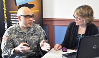 Lt. Col. Christopher Eng, a U.S. Army Reserve officer currently assigned to the Defense Threat Reduction Agency, discusses his future plans with MyArmyBenefits contractor representative, Linda Wellman. Wellman, a retired Army Reserve chief warrant officer four, also contributes her personal experience and knowledge when discussing retirement plans. MyArmyBenefits was one of the organizations represented at the 99th Regional Support Command’s Army Reserve Pre-Retirement Training at Fort Belvoir, Virginia, March 18, 2017. (Army Reserve Photo by Capt. Valerie Palacios/ Released) 