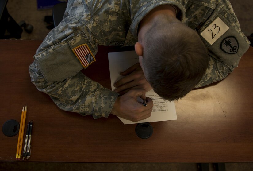 U.S. Army Spc. William Cornacchione takes a written exam during the 200th Military Police Command’s Best Warrior Competition held at Fort Hunter Liggett, Calif, Mar. 17, 2017. Competitors test their Army aptitude by completing warfare simulations, board interviews, physical fitness tests, written exams, and warrior tasks and battle drills. (U.S. Army photo by Sgt. Elizabeth Taylor)