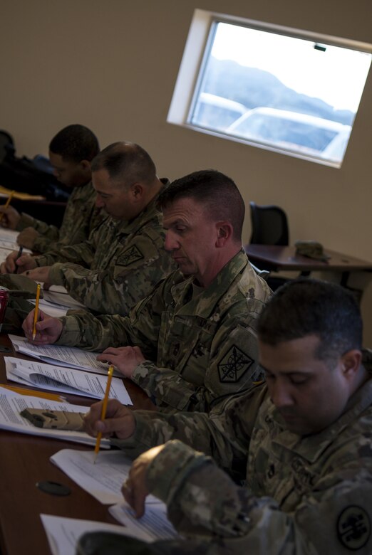 U.S. Army cadre members grade exams during this year’s 200th Military Police Command’s Best Warrior Competition held at Fort Hunter Liggett, Calif, Mar. 17, 2017. Competitors test their Army aptitude by completing warfare simulations, board interviews, physical fitness tests, written exams, and Warrior tasks and battle drills. (U.S. Army photo by Sgt. Elizabeth Taylor)