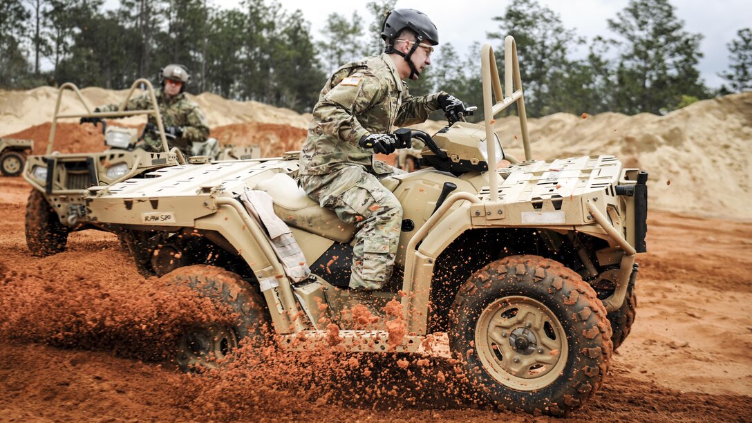 A soldier executes a sharp turn in an all-terrain vehicle during training in Navarre, Fla., March 14, 2017, to qualify to use ATVs in special operations missions. The soldier is assigned to the 1st Battalion, 10th Special Forces Group. Air Force photo by Airman 1st Class Dennis Spain