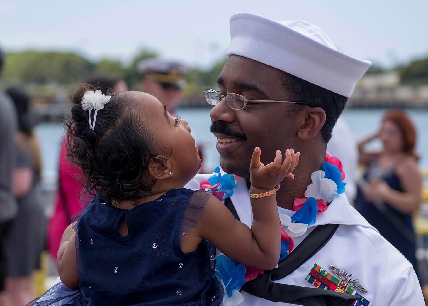 170323-N-LY160-0416 PEARL HARBOR, Hawaii (March 23, 2017) Yeoman 2nd Class Bryce Mack, a native of Dallas, Texas, reunites with his daughter on the submarine piers in Joint Base Pearl Harbor-Hickam. The Los Angeles-class fast-attack submarine USS Louisville (SSN 724) successfully completed a six-month deployment to the Western Pacific Ocean. (U.S. Navy photo by Mass Communication Specialist 2nd Class Michael H. Lee/Released)