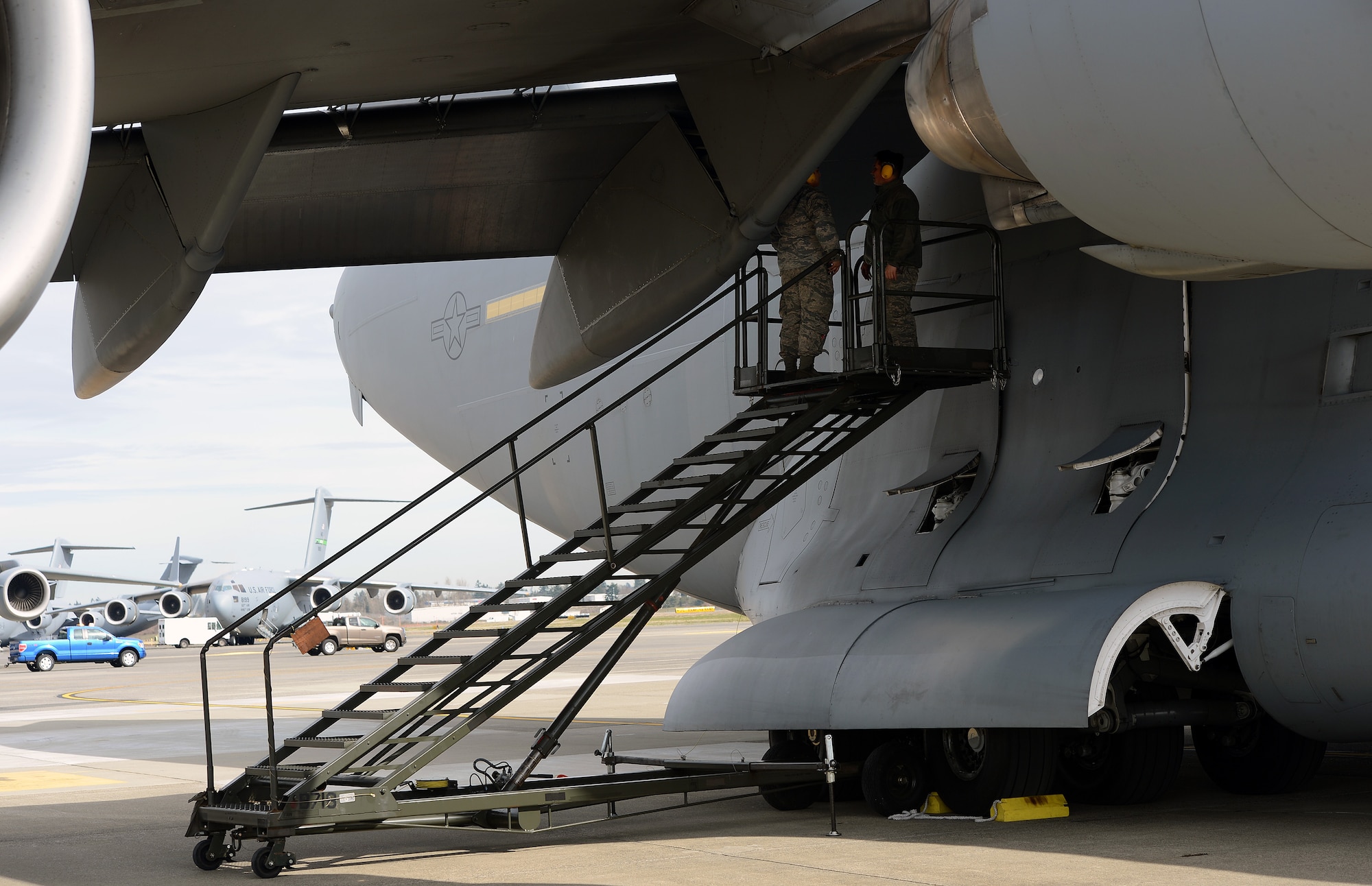 Senior Airman Facundo Santamina (left), 62nd Aircraft Maintenance Squadron crew chief and Staff Sgt. James Pomeroy, 62nd AMXS crew chief, inspect the wing of a C-17 Globemaster III aircraft March 20, 2017 at Joint Base Lewis-McChord, Wash. Crew chiefs have a large number of different duties they are trained in and perform regularly to ensure the safety of aircraft. (U.S. Air Force photo/Senior Airman Jacob Jimenez)  