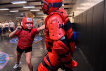Senior Airman Melida Keres, left, 628th Security Forces Squadron phoenix raven, participates in a Red Man demonstration with Staff Sgt. Larry Blue, right, 628th SFS phoenix raven, here, March 24, 2017. With five out of 32 phoenix ravens being females, Joint Base Charleston is home to more than half of the female ravens in AMC.