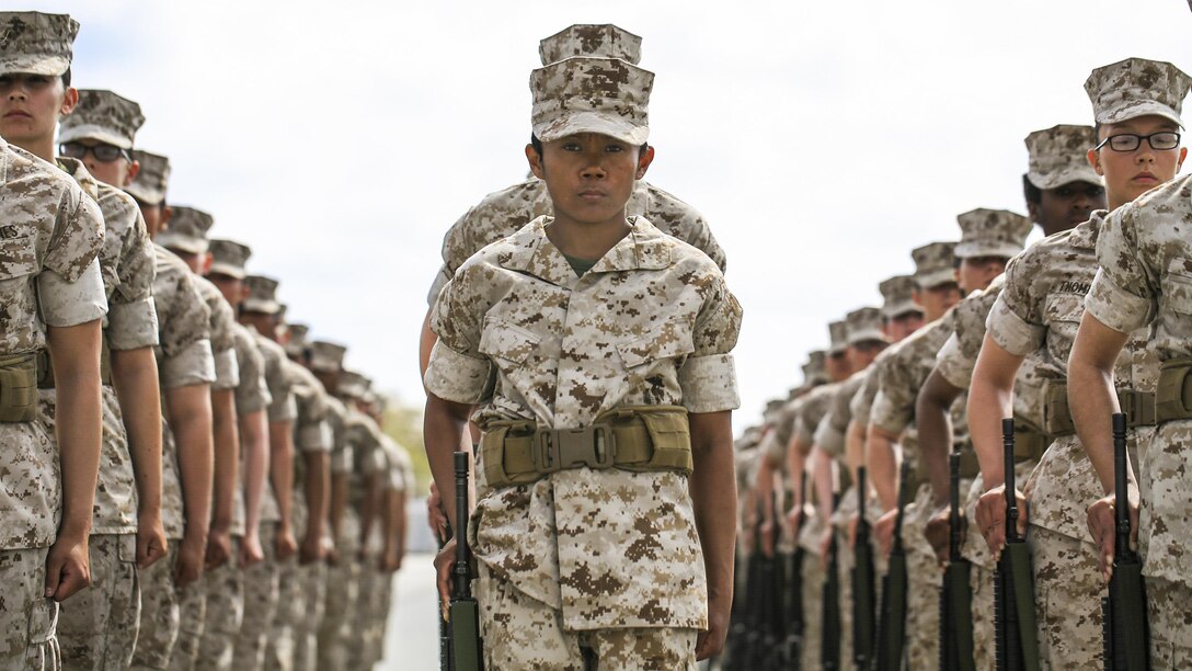 Marine Corps recruits wait for the next command during a final drill evaluation at Marine Corps Recruit Depot Parris Island, S.C., March 22, 2017. The recruits, assigned to Platoon 4011, 4th Battalion, Recruit Training Regiment, are scored for final drill according to confidence, attention to detail and discipline. Marine Corps photo by Lance Cpl. Sarah Stegall