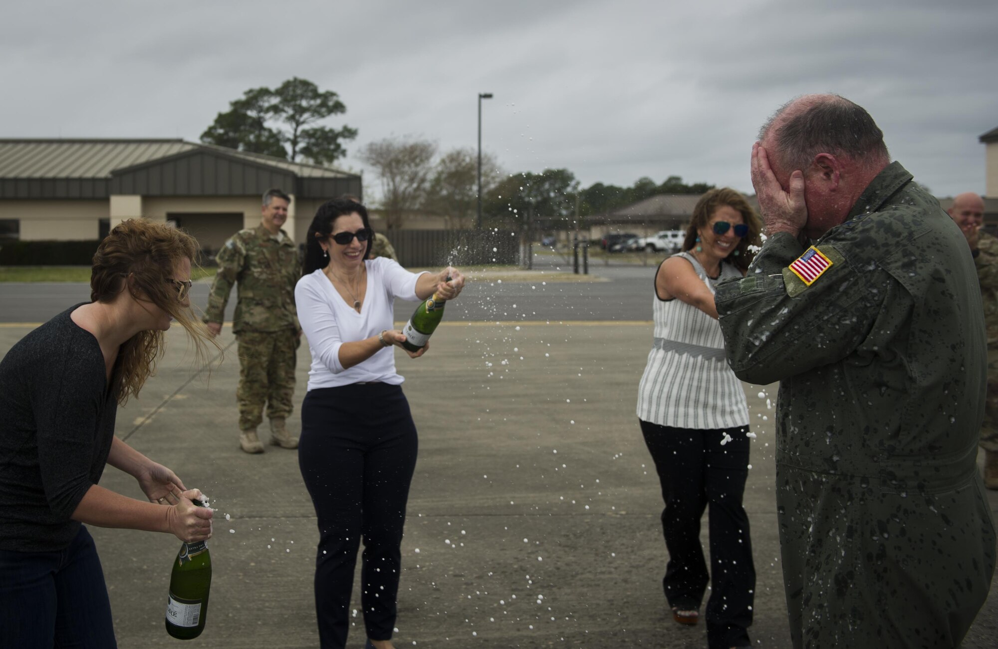 Maj. Gen. Eugene Haase, left, vice commander of Air Force Special Operations Command, is greeted by family and friends, after Haase’s final flight before his retirement at Hurlburt Field, Fla., March 24, 2017. Haase has logged more than 3,500 flight hours in his career and served as the AFSOC vice commander for the past 30 months before his retirement ceremony, April 10. 