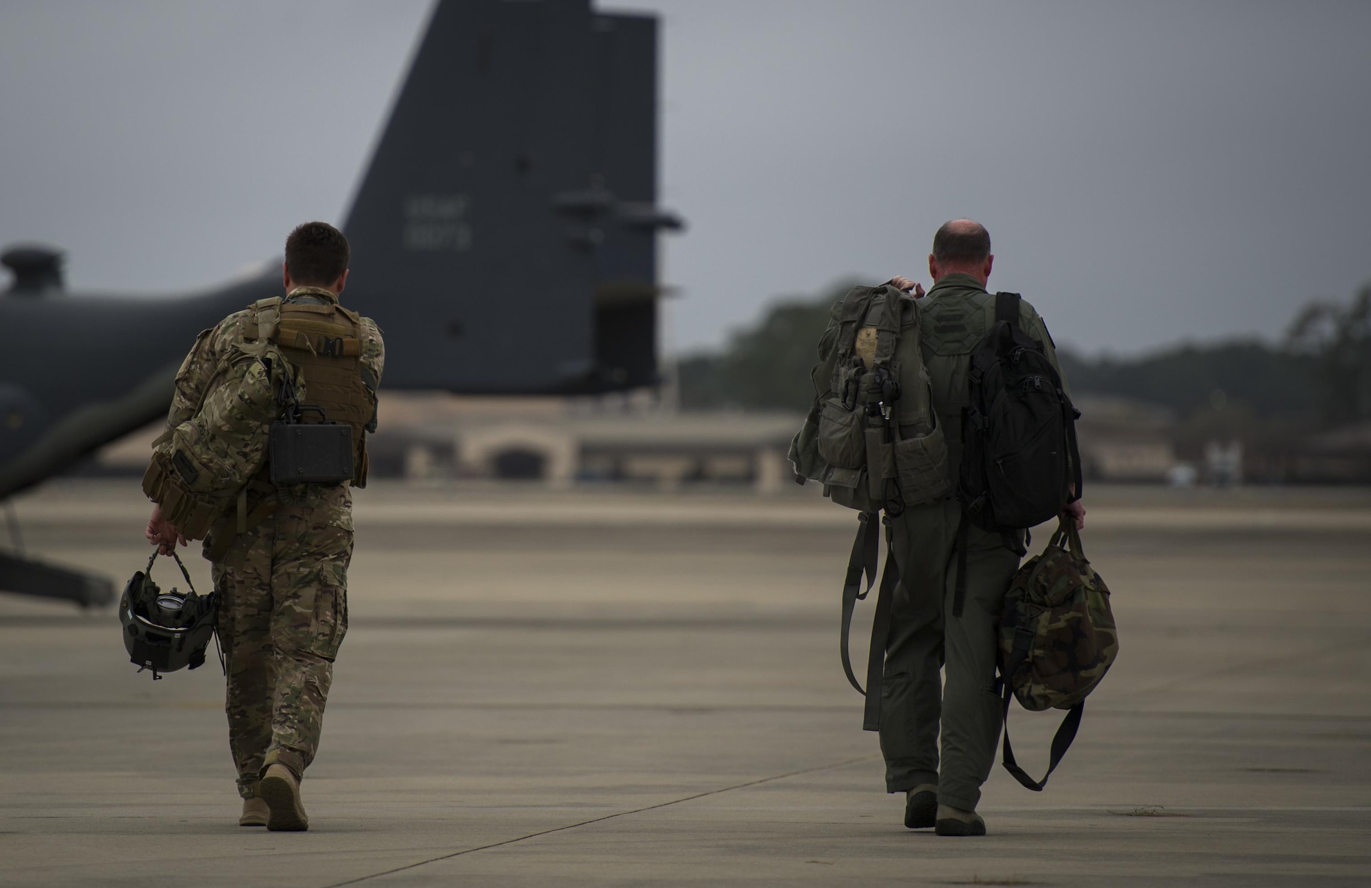 Maj. Nathan Eaton, left, a pilot with the 8th Special Operations Squadron, walks with Maj. Gen. Eugene Haase, vice commander of Air Force Special Operations Command, to an 8th SOS CV-22 Osprey tiltrotor aircraft before Haase’s final flight at Hurlburt Field, Fla., March 24, 2017. Haase has logged more than 3,500 flight hours in his career and served as AFSOC’s vice commander for the past 30 months before his retirement, April 10. (U.S. Air Force photo by Airman 1st Class Joseph Pick)