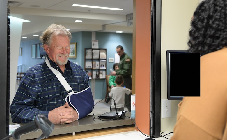 Retired Maj. Jessie Carroll picks up his prescription March 13, 2017, at Columbus Air Force Base, Mississippi. Carroll recently injured his arm in an accident. (U.S. Air Force photo illustration by Airman 1st Class Beaux Hebert)