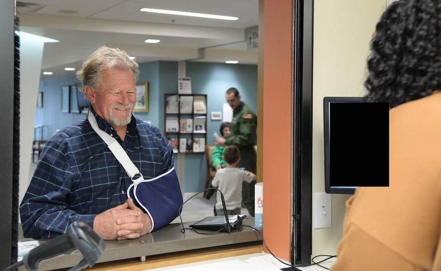 Retired Maj. Jessie Carroll picks up his prescription March 13, 2017, at Columbus Air Force Base, Mississippi. Carroll recently injured his arm in an accident. (U.S. Air Force photo illustration by Airman 1st Class Beaux Hebert)