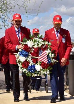 (Ret.) Tech. Sgt. Rudolf Silas, and (Ret.) Lt. Col. Robert Ashby, two of the original Tuskegee Airman, carry a wreath Mar. 23 during the fourth annual Commemoration Day for the Tuskegee Airmen in Arizona at Luke Air Force Base, Ariz. (U.S. Air Force photo by Tech. Sgt. Louis Vega Jr.)