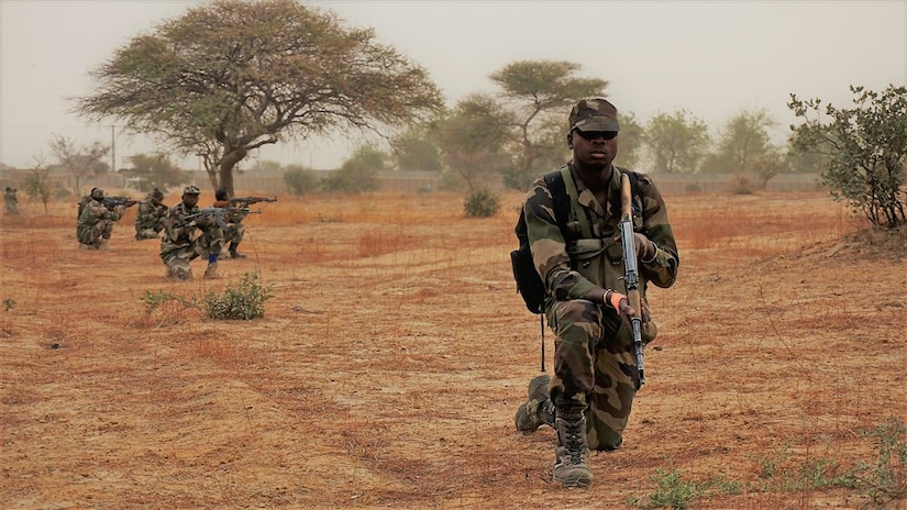 A Nigerian soldier provides rear security for his squad while they perform a dismounted patrol during Exercise Flintlock 2017 in Diffa, Niger, March 11, 2017. Flintlock exercises strengthen security institutions, promote multilateral sharing of information, and develop interoperability among partner nations in the Trans-Sahara. Army photo by Spc. Zayid Ballesteros