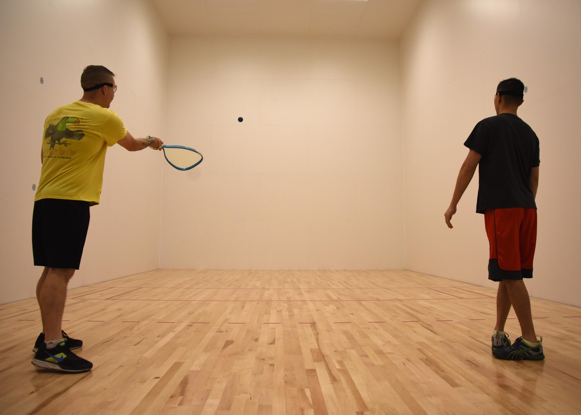 Staff Sgt. Kaleb Mayfield, 30th Space Wing Public Affairs broadcaster, plays racquetball with Tech. Sgt. Jim Araos, 30th SW PA NCOIC of command information, March 24, 2017, Vandenberg Air Force Base, Calif. Vandenberg recently reopened its newly renovated racquetball courts, March 24, in Building 9002 behind the 30th FSS Fitness and Sports Center Annex. (U.S. Air Force photo by Airman 1st Class Clayton Wear/Released)
