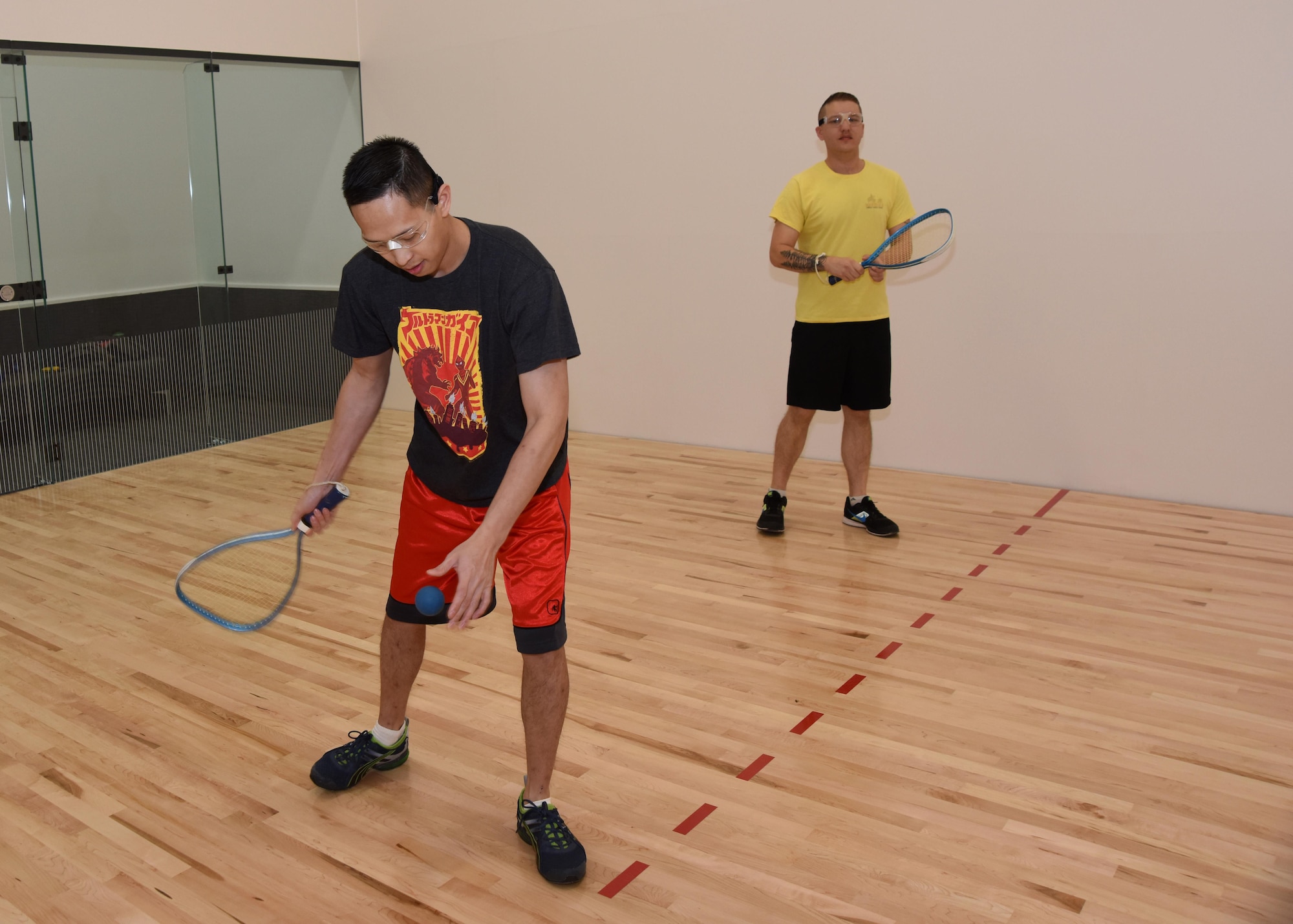 Staff Sgt. Kaleb Mayfield, 30th Space Wing Public Affairs broadcaster, plays racquetball with Tech. Sgt. Jim Araos, 30th SW PA NCOIC of command information, March 24, 2017, Vandenberg Air Force Base, Calif. Vandenberg recently reopened its newly renovated racquetball courts, March 24, in Building 9002 behind the 30th FSS Fitness and Sports Center Annex. (U.S. Air Force photo by Airman 1st Class Clayton Wear/Released)