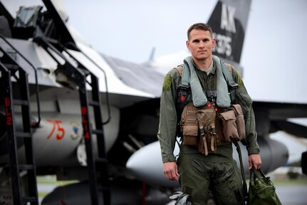U.S. Air Force Tech. Sgt. Wesley Walker, 354th Maintenance Squadron aircraft armament systems technician, poses in front of an F-16 Fighting Falcon at Royal Australian Air Force Base Williamtown, in New South Wales, Australia, March 24, 2017. Prior to the 18th Aggressor Squadron completing their final sortie in Exercise Diamond Shield, Walker was offered an opportunity to observe the mission of training and preparing Royal Australian Air Force fighter combat instructors, airspace battle managers, fighter intelligence instructors and fighter combat controllers of the RAAF Air Warfare Centre Instructors Course from a perspective he’s never seen before; from 30,000 feet in the air. (U.S. Air Force photo by Tech. Sgt. Steven R. Doty)