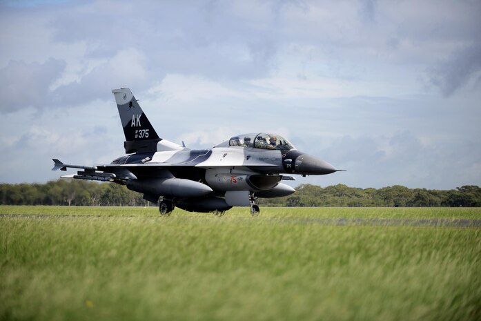 U.S. Air Force Maj. Shawn McGoffin, 354 Fighter Wing deputy inspector general and F-16 pilot, and U.S. Air Force Tech. Sgt. Wesley Walker, 354th Maintenance Squadron aircraft armament systems technician, taxi in an F-16 Fighting Falcon at Royal Australian Air Force Base Williamtown, in New South Wales, Australia, March 24, 2017. Prior to the 18th Aggressor Squadron completing their final sortie in Exercise Diamond Shield, Walker was offered an opportunity to observe the mission of training and preparing Royal Australian Air Force fighter combat instructors, airspace battle managers, fighter intelligence instructors and fighter combat controllers of the RAAF Air Warfare Centre Instructors Course from a perspective he’s never seen before; from 30,000 feet in the air. (U.S. Air Force photo by Tech. Sgt. Steven R. Doty)