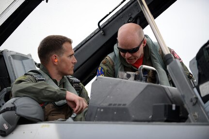 U.S. Air Force Maj. Shawn McGoffin, 354 Fighter Wing deputy inspector general and F-16 pilot (right), orients U.S. Air Force Tech. Sgt. Wesley Walker, 354th Maintenance Squadron aircraft armament systems technician, to the F-16 Fighting Falcon at Royal Australian Air Force Base Williamtown, in New South Wales, Australia, March 24, 2017. Prior to the 18th Aggressor Squadron completing their final sortie in Exercise Diamond Shield, Walker was offered an opportunity to observe the mission of training and preparing Royal Australian Air Force fighter combat instructors, airspace battle managers, fighter intelligence instructors and fighter combat controllers of the RAAF Air Warfare Centre Instructors Course from a perspective he’s never seen before; from 30,000 feet in the air. (U.S. Air Force photo by Tech. Sgt. Steven R. Doty)