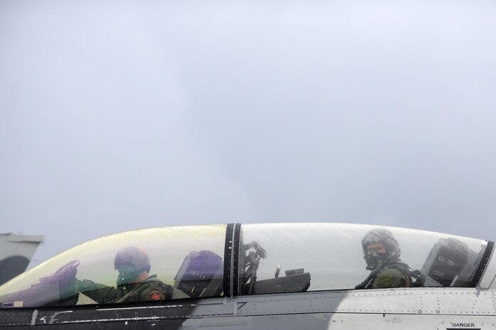 U.S. Air Force Maj. Shawn McGoffin, 354 Fighter Wing deputy inspector general and F-16 pilot (left), and U.S. Air Force Tech. Sgt. Wesley Walker, 354th Maintenance Squadron aircraft armament systems technician, await clearance to taxi at Royal Australian Air Force Base Williamtown, in New South Wales, Australia, March 24, 2017. Prior to the 18th Aggressor Squadron completing their final sortie in Exercise Diamond Shield, Walker was offered an opportunity to observe the mission of training and preparing Royal Australian Air Force fighter combat instructors, airspace battle managers, fighter intelligence instructors and fighter combat controllers of the RAAF Air Warfare Centre Instructors Course from a perspective he’s never seen before; from 30,000 feet in the air. (U.S. Air Force photo by Tech. Sgt. Steven R. Doty)