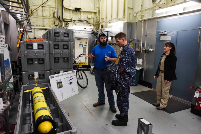 170306-N-ED185-013 FLEET ACTIVITIES YOKOSUKA, Japan (March 6, 2017) Mark Gucherau, an electronic technician aboard the Pathfinder-class oceanographic survey ship USNS Henson (T-AGS 63) explains the ship’s Naval Oceanographic Office Glider system to Rear Adm. Richard A. Correll, commander, Submarine Group 7. Henson is visiting Yokosuka for a port visit. 