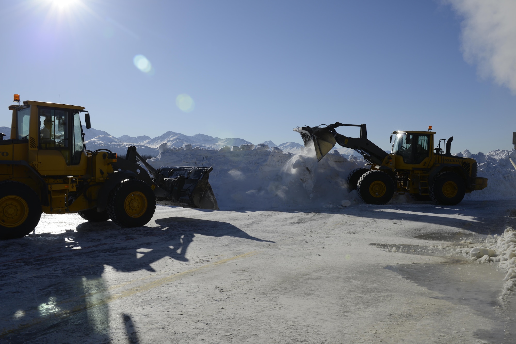 An operator assigned to the 773d Civil Engineering Squadron’s Horizontal Maintenance section, loads ice and snow into a Trecan snowmelter machine on the Joint Base Elmendorf-Richardson flight line, March 22, 2017. This machine, the only one in the U.S. Air Force’s inventory, has been operating for more than 300 hours this winter, allowing crews of two to work 24/7, keeping the flight line operational. 