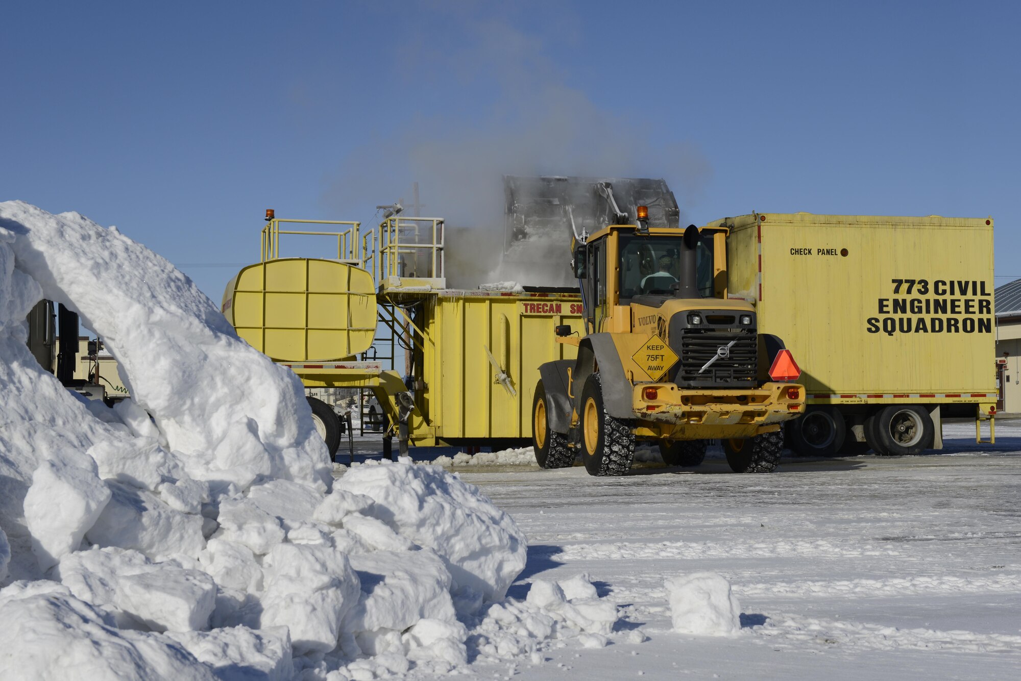 An operator assigned to the 773d Civil Engineering Squadron’s Horizontal Maintenance section, loads ice and snow into a Trecan snowmelter machine on the Joint Base Elmendorf-Richardson flight line, March 22, 2017. This machine, the only one in the U.S. Air Force’s inventory, has been operating for more than 300 hours this winter, allowing crews of two to work 24/7, keeping the flight line operational. 