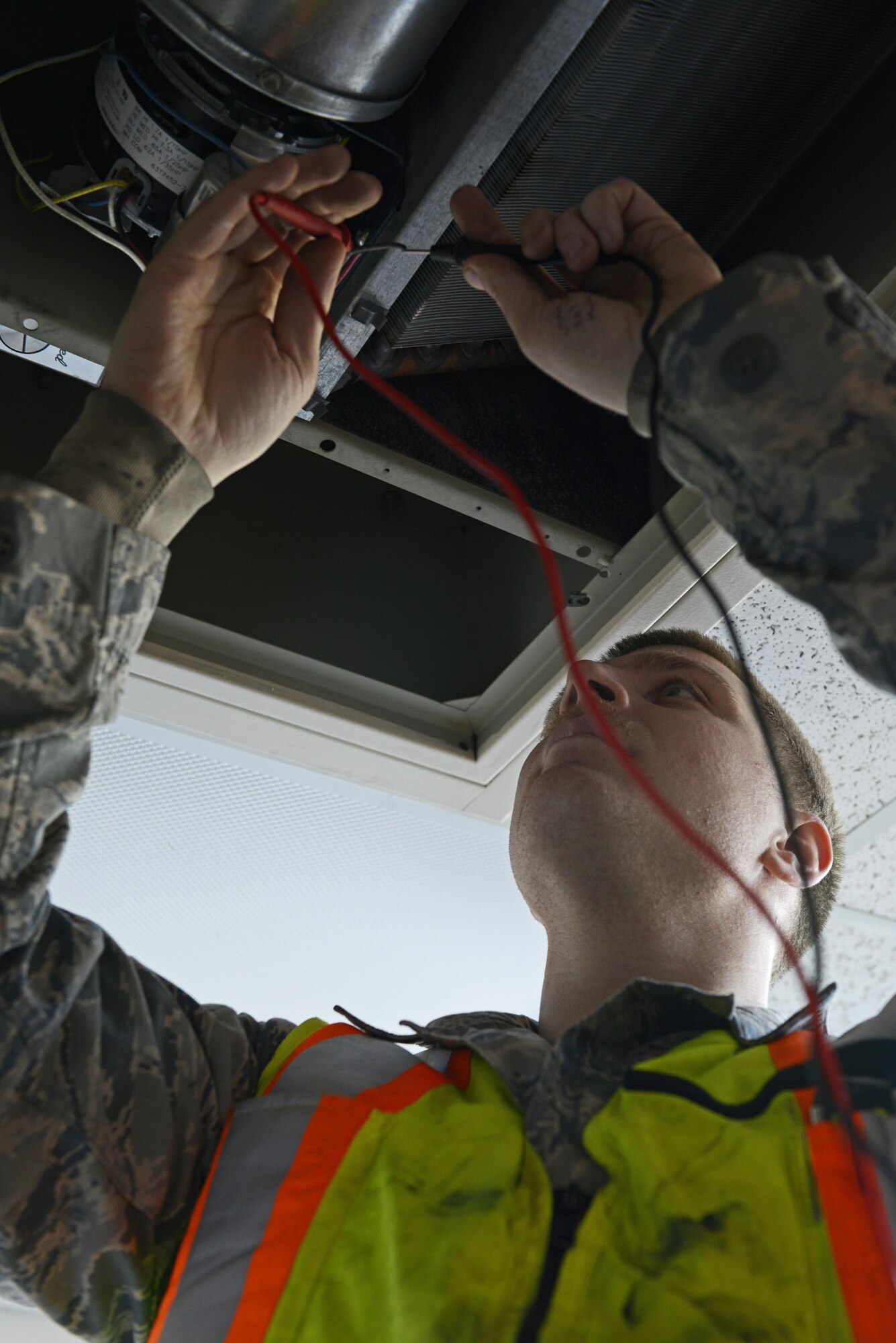 U.S. Air Force Staff Sgt. Brett Achterhof, Heating Ventilation Air Conditioning/Refrigerant journeyman, 773 Civil Engineering Squadron, trouble shoots a unit heater motor on Joint Base Elmendorf-Richardson, March 22, 2017. Achterhof was responding to a service call about the heater producing a smoky smell. 