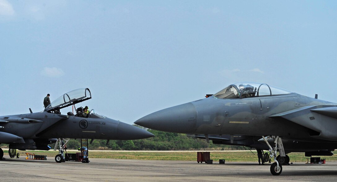A U.S. Air Force F-15 (front) taxis past a Republic of Singapore air force F-15 during exercise Cope Tiger 17 at Korat Royal Thai Air Force Base, Thailand, March 24, 2017. The annual multilateral exercise, which involves a combined total of 76 aircraft and 43 air defense assets, is aimed at improving combined combat readiness and interoperability between the Republic of Singapore air force, Royal Thai air force, and U.S. Air Force, while concurrently enhancing the three nations' military relations. (U.S. Air Force photo by Staff Sgt. Kamaile Chan)