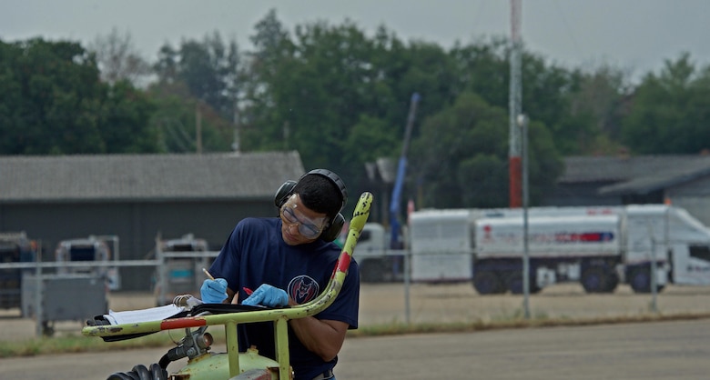 U.S. Air Force Senior Airman Gabriel Cisneros, assigned to the 44th Aircraft Maintenance Unit from Kadena Air Base, Japan, completes a checklist during exercise Cope Tiger 17 at Korat Royal Thai Air Force Base, Thailand, March 24, 2017. The annual multilateral exercise, which involves a combined total of 76 aircraft and 43 air defense assets, is aimed at improving combined combat readiness and interoperability between the Republic of Singapore air force, Royal Thai air force, and U.S. Air Force, while concurrently enhancing the three nations' military relations. (U.S. Air Force photo by Staff Sgt. Kamaile Chan)