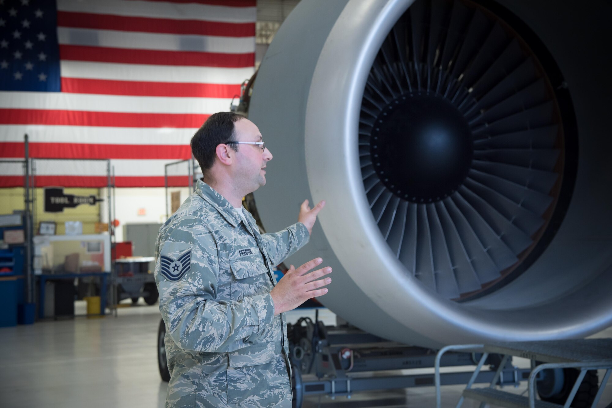 Tech Sgt. Sean Preston, 433rd Maintenance Squadron, explains the turbine engine of a C-5 Super Galaxy aircraft during a 403rd Wing hosted civic leader tour at Joint Base San Antonio, March 23-24. (U.S. Air Force photo/Staff Sgt. Heather Heiney)