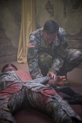 U.S. Army Maj. Stephen Harper, Medical Education and Training Corps department chair demonstrates how to practice medical care on a simulation dummy to Gulf Coast civic leaders during a 403rd Wing hosted civic leader tour at Joint Base San Antonio, March 23-24. (U.S. Air Force photo/Staff Sgt. Heather Heiney)