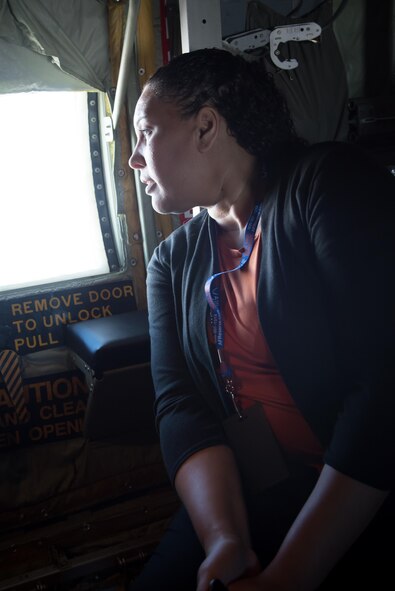 Rebecca Smith, Beau Rivage Hotel and Casino director of talent aquisition and management, looks out the window of a WC-130J Super Hercules aircraft during a 403rd Wing hosted civic leader tour at Joint Base San Antonio, March 23-24. (U.S. Air Force photo/Staff Sgt. Heather Heiney)