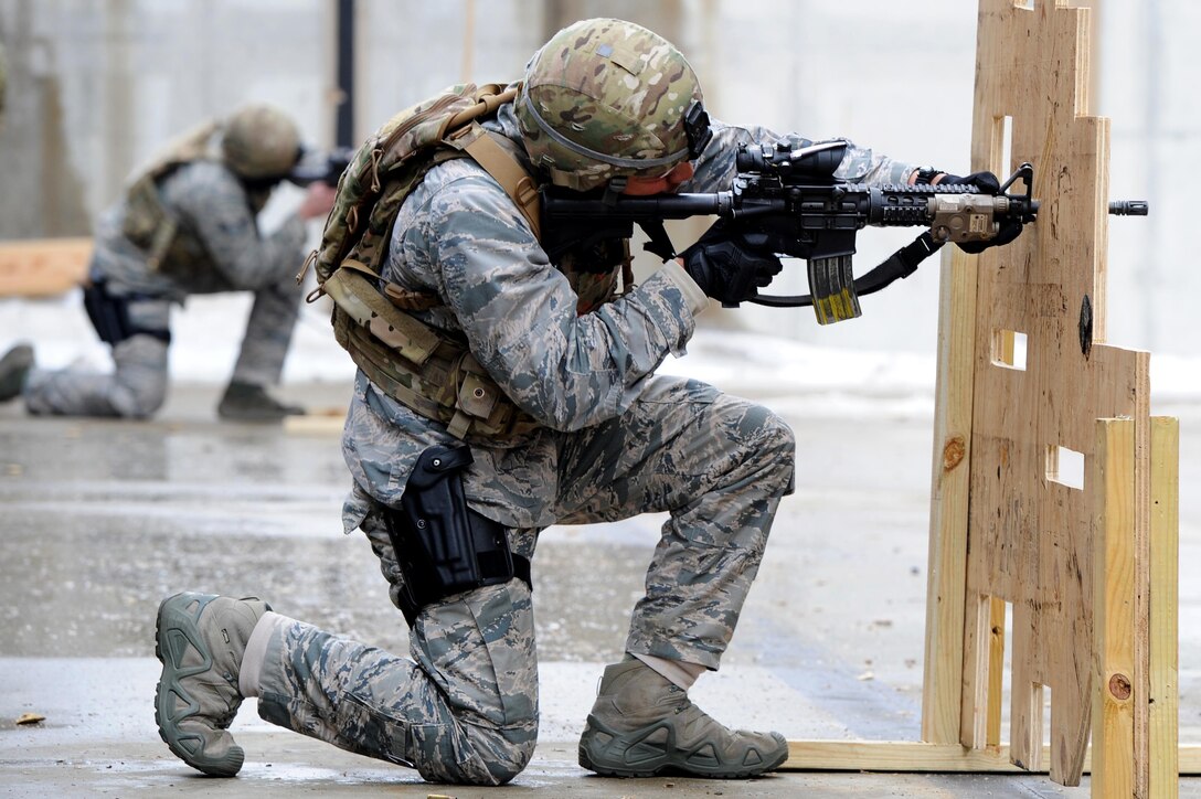 1st Lt. Kevin Aguilar, 5th Security Forces Squadron defender, fires an M4 rifle at a target at Minot Air Force Base, N.D., March 16, 2017. The defenders were timed during their tryouts at the shooting range. (U.S. Air Force photo/Senior Airman Kristoffer Kaubisch)