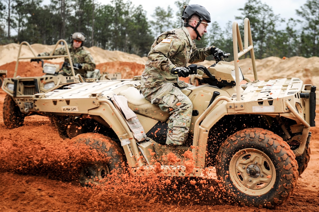 A soldier executes a sharp turn in an all-terrain vehicle during training in Navarre, Fla., March 14, 2017, to qualify to use ATVs in special operations missions. The soldier is assigned to the 1st Battalion, 10th Special Forces Group. Air Force photo by Airman 1st Class Dennis Spain