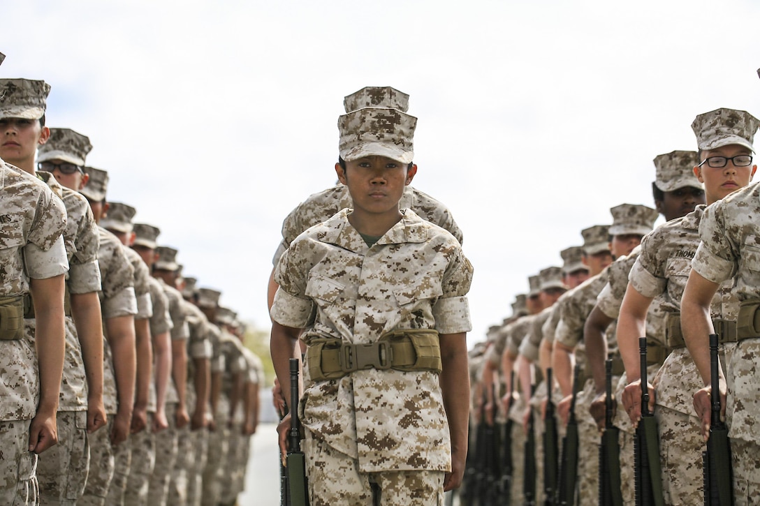 Marine Corps recruits wait for the next command during a final drill evaluation at Marine Corps Recruit Depot Parris Island, S.C., March 22, 2017. The recruits, assigned to Platoon 4011, 4th Battalion, Recruit Training Regiment, are scored for final drill according to confidence, attention to detail and discipline. Marine Corps photo by Lance Cpl. Sarah Stegall