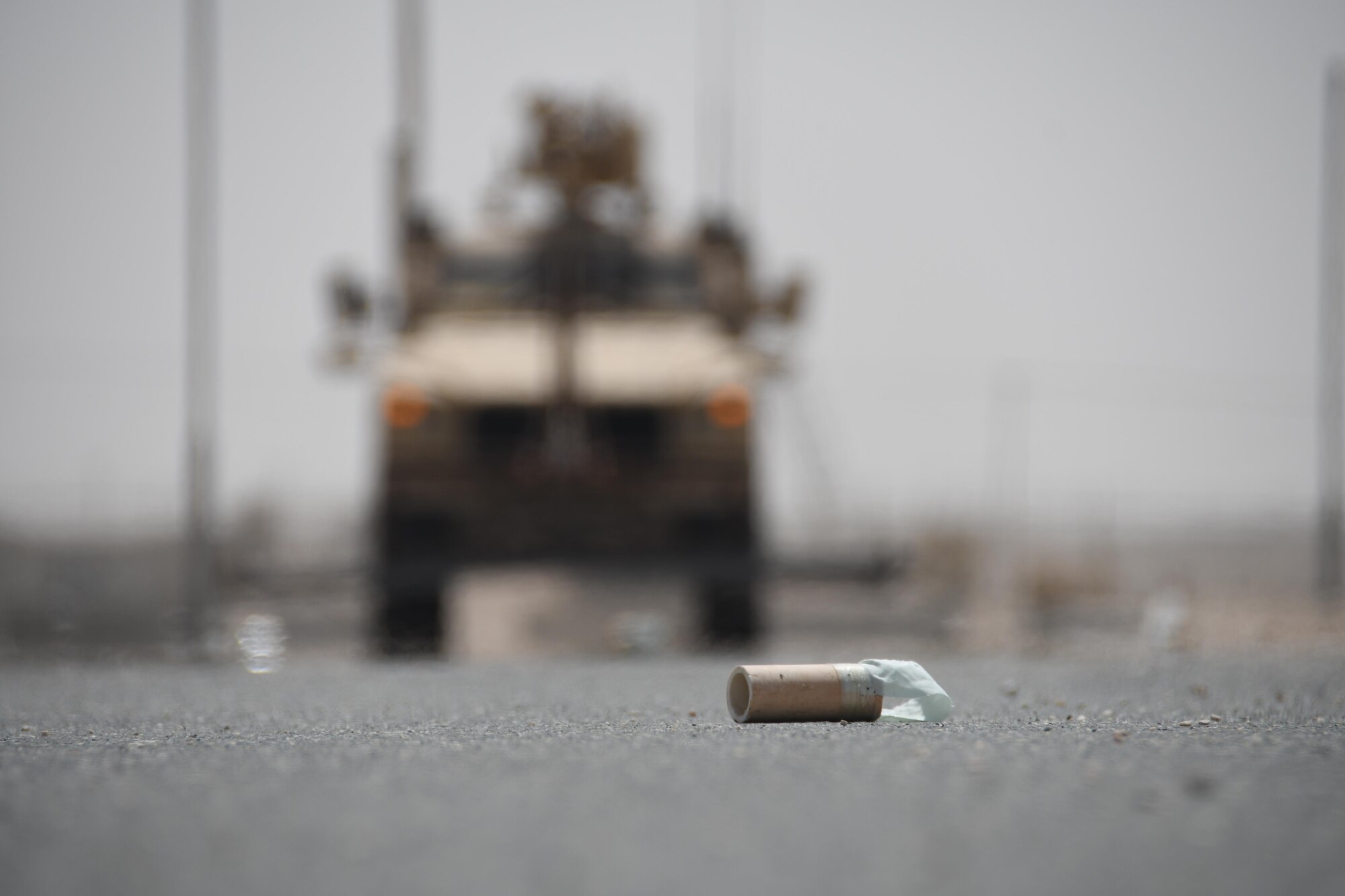 An improvised explosive device prop lies on a simulated airfield at Al Udeid Air Base, Qatar, March  21, 2017. The 379th Expeditionary Civil Engineer Squadron Explosive Ordnance Disposal Flight conducted an exercise that involved sweeping IED’s off of a simulated runway with a mine resistant ambush protected all-terrain vehicle, and then disposing of them safely. (U.S. Air Force photo by Senior Airman Miles Wilson)
