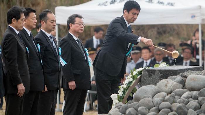 Shunsuke Takei, Japanese parliamentary vice-minister for foreign affairs, dedicates water on an Iwo Jima memorial during a wreath-laying presentation as part of the 72nd Reunion of Honor ceremony on Iwo To, Japan March 25, 2017. The event presented the opportunity for the U.S. and Japanese people to mutually remember and honor thousands of service members who fought and died on the hallowed grounds of Iwo Jima. 