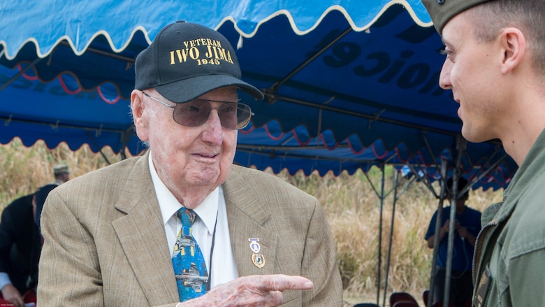 Iwo Jima veteran Fiske Hanley III talks with Marines after the wreath-laying ceremony during the 72nd Reunion of Honor commemorative service on Iwo To, Japan March 25, 2017.  Hanley was one of eight veterans in attendance alongside American and Japanese distinguished guests, both military and civilian. This event presented the opportunity for the U.S. and Japanese people to mutually remember and honor thousands of service members who fought and died on the hallowed grounds of Iwo Jima. 