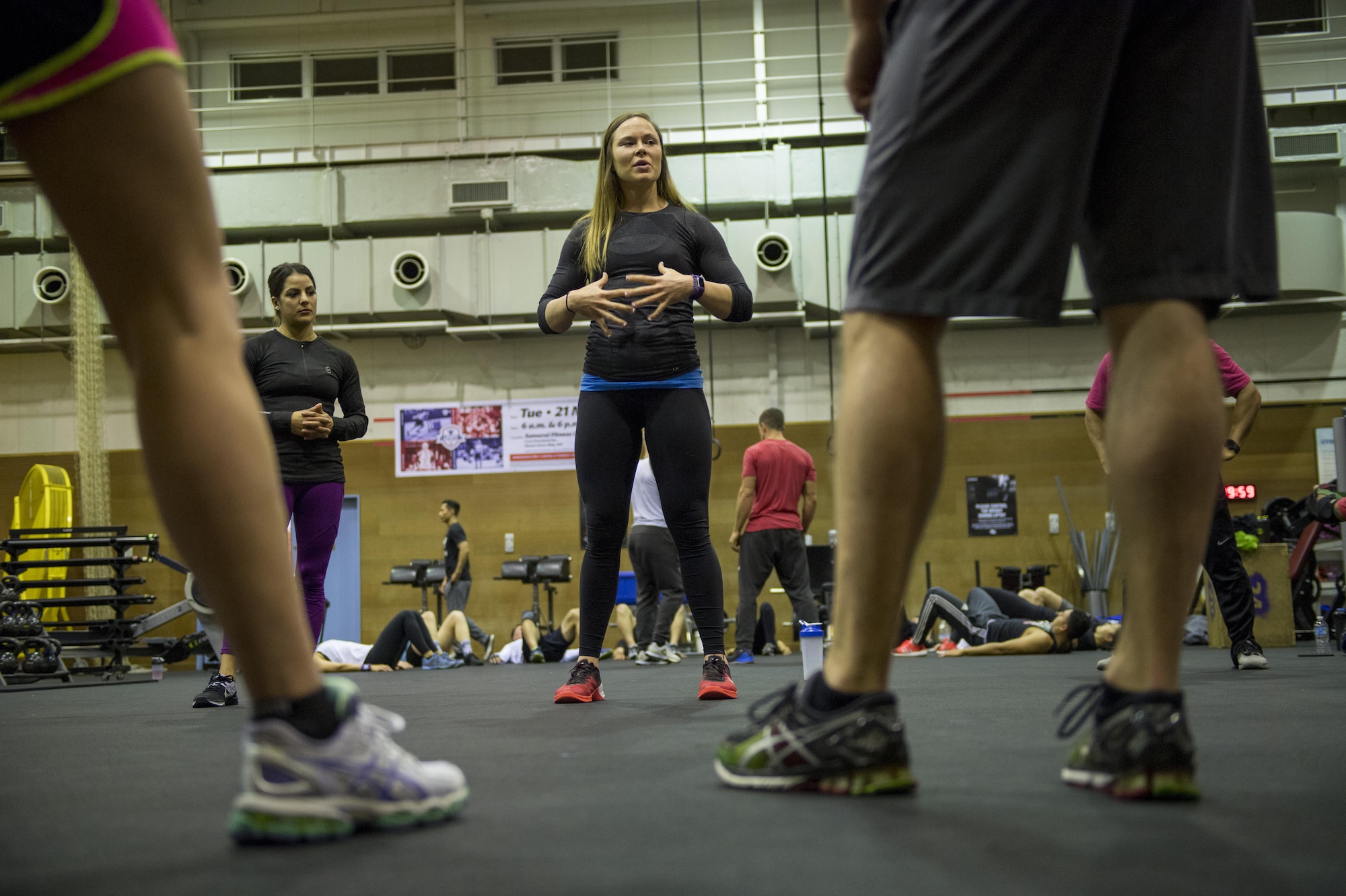 Catherine Blatner, Invictus CrossFit coach and professional CrossFit competitor, speaks to participants the importance of core strength during the LifeFit Tour exercise demonstration March 21, 2017, at Yokota Air Base Japan. Blatner has been coaching CrossFit since 2011, and has been part of the prestigious Invictus CrossFit coaching team since 2014, and holds multiple CrossFit coaching certification. (U.S. Air Force photo by Airman 1st Class Donald Hudson)